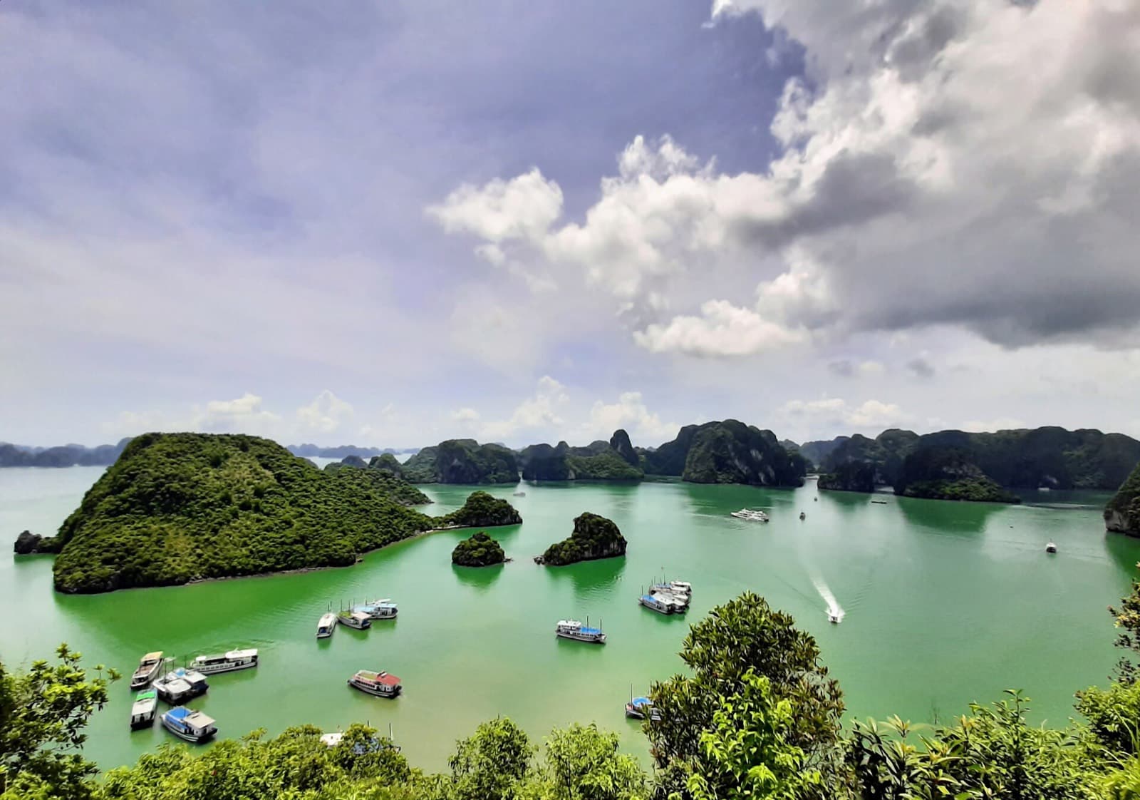 Limestone karsts and boats in Ha Long Bay, Vietnam