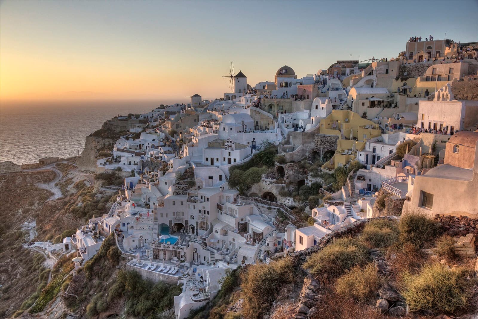 White houses of Oia on the Santorini caldera at sunset, Greece